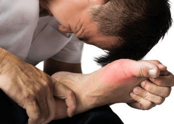 Man with painful and swollen right foot due to gout inflammation