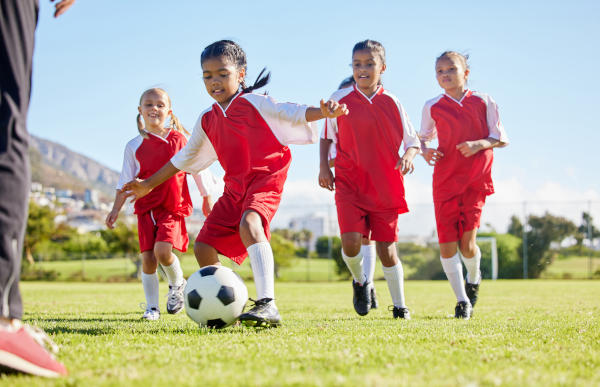 girls playing soccer | child heel pain and sports